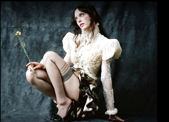 singer-songwriter Holly Humberstone can be seen crouching down and showing her legs